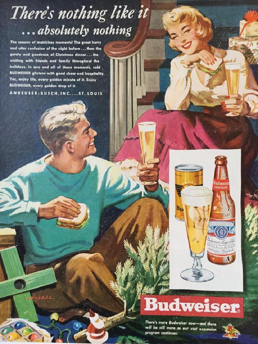 1949 Budweiser Beer Christmas Advertisement: Original 1949 magazine advertisement for Budweiser beer. Features a smiling couple, enjoying beer & sandwiches as they decorate a Christmas tree. Slogan reads, "There's nothing like it...absolutel