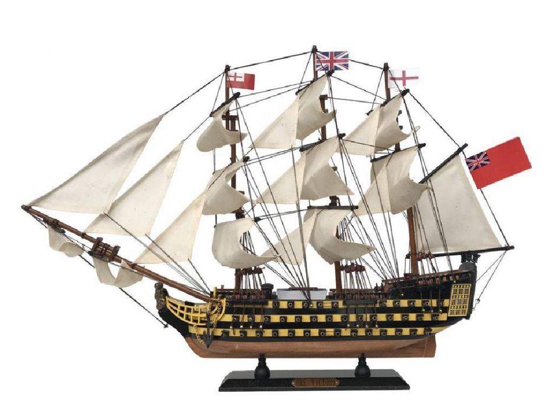 Wooden Hms Victory Tall Model Ship 24'': Fine craftsmanship and attention to detail highlight this scale tall model ship replica of the HMS Victory, the UK's most famous fighting tall ship. Whether seated upon a shelf, desk or table, this HM