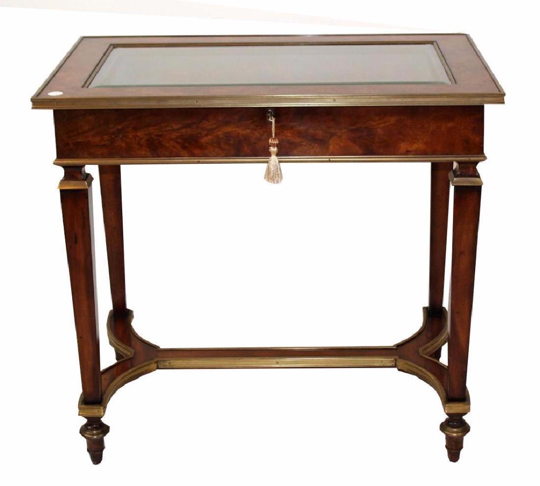 Theodore Alexander Althorpe Display Case: Theodore Alexander Althorpe Lift top display or jewelry case, On tapered legs with brass trim. 29 1/2"h x 31 1/2"w x 19 1/2"d