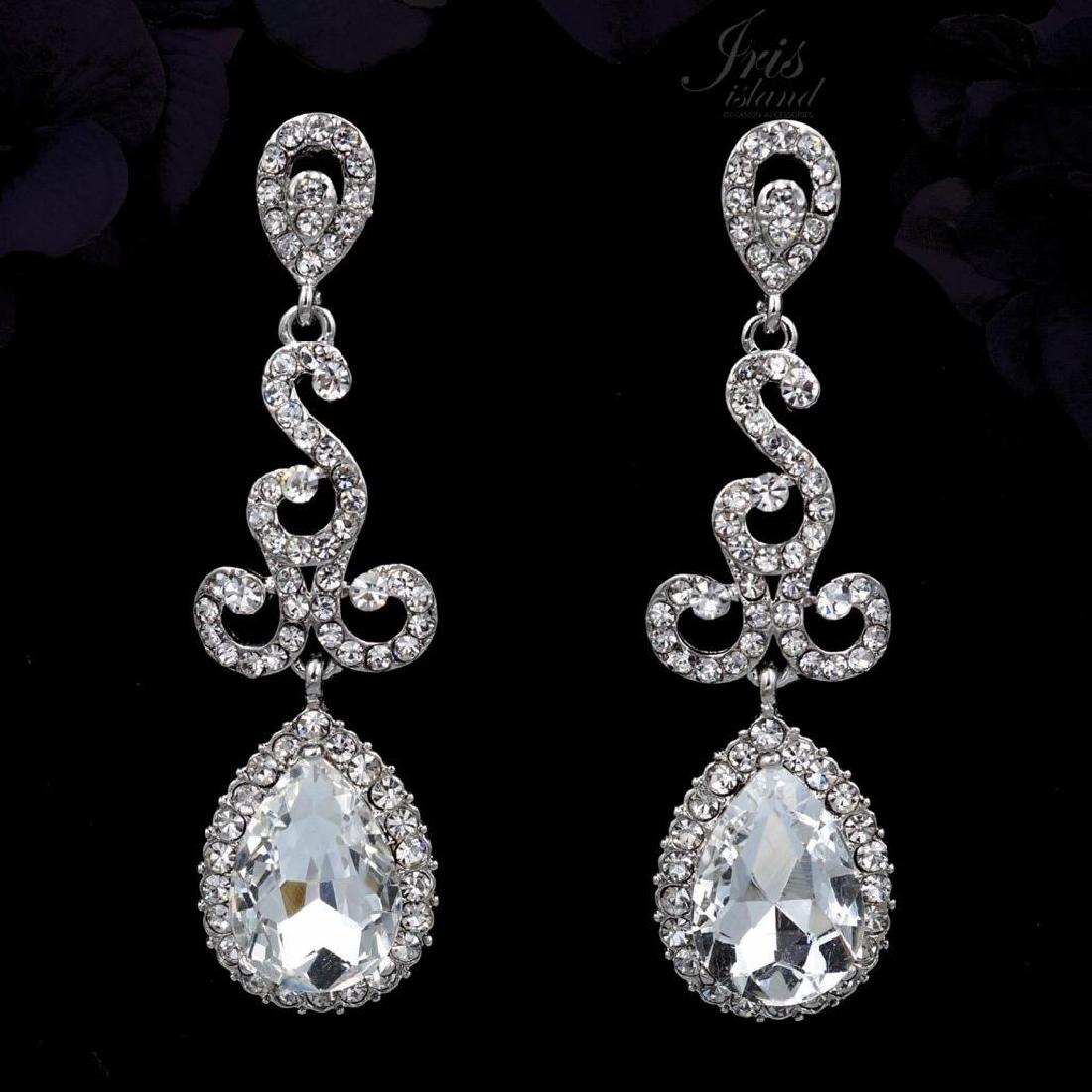 Rhodium Plated Clear Crystal Rhinestone Drop Dangle: Rhodium Plated Clear Crystal Rhinestone Drop Dangle Chandelier Earrings Type: Pierced Earrings Stone / Color: Czech Crystal / Clear Metal / Color: Rhodium Plated Alloy / Rhodium Length: 2.625" Weight: