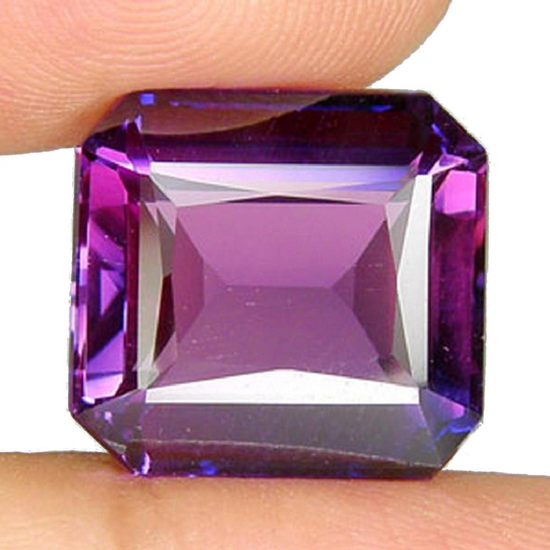 14.40 Ct Emerald Cut Diamond: Type: Alexandrite Shape: Emerald Cut Color: Purple Total Weight: 14.40 Ct. Total Size: 14.3x12.1x6.6 Mm. Treatment: Lab Hardness: 9 Pieces: 1 - 10339-050218-EB-55703