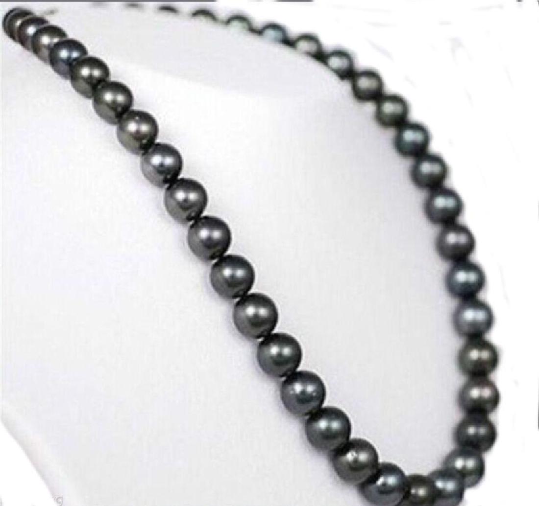 9-10mm Natural Black Tahitian Pearl 25" Necklace: 9-10mm natural black Tahitian pearls 25" necklace with 14kt gold clasp. 9959A-032618-EB-94359