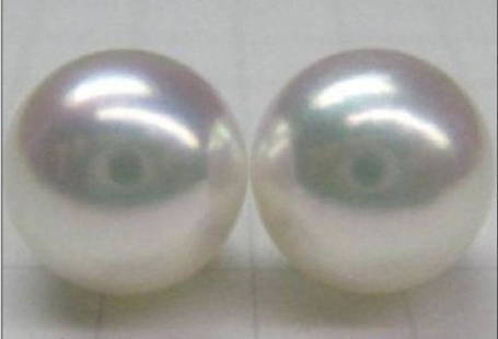 Huge 13-14mm Perfect White South Sea Pearl 14kt: 13-14mm perfect white South Sea pearl earrings on 14kt gold posts. Their large size, limited culturing area, and extended growth period all combine to make South Sea pearls the rarest of all pearl