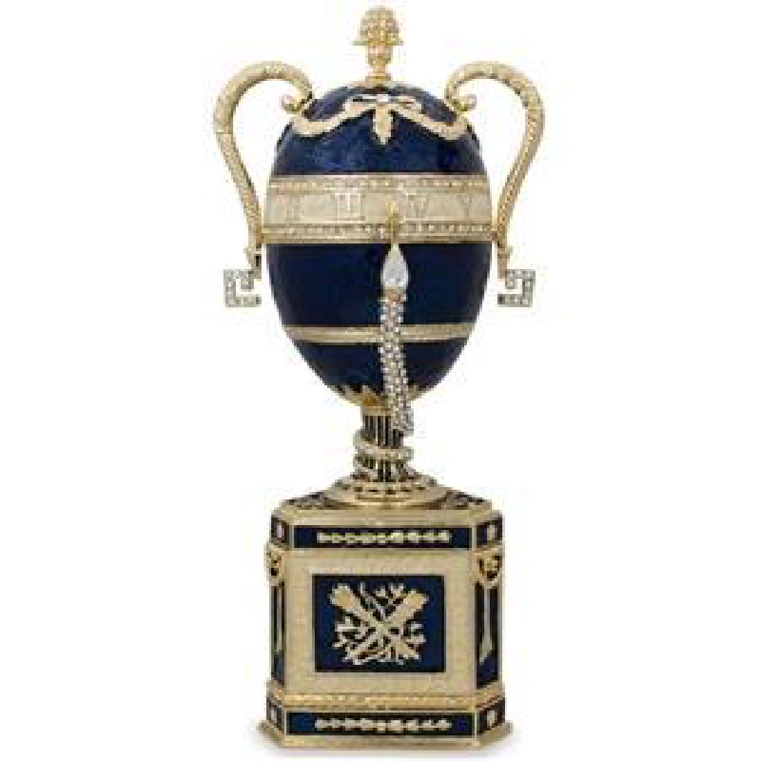 1895 Blue Serpent Clock Russian Faberge Egg: 1895 Blue Serpent Clock Russian Faberge Egg 7.75'' (H) X 2.75'' (D) Pewter, Enamel, Crystals Boxed Faberge Eggs have a remarkable story and while the original Faberge eggs are virtually priceless, ext