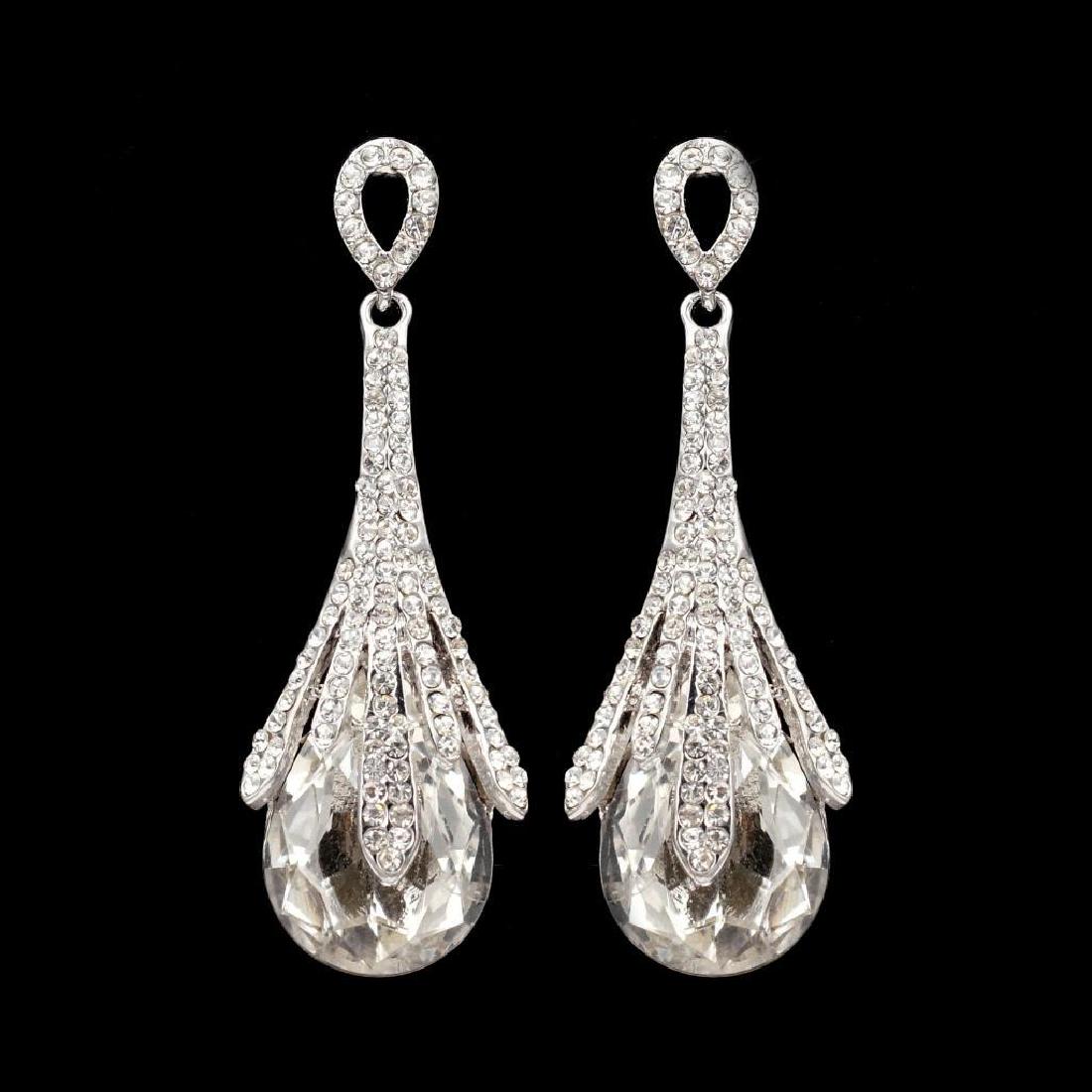 Rhodium Plated Clear Crystal Rhinestone Wedding Drop: Type: Pierced earrings. Stone / Color: Czech crystal / Clear. Metal / Color: Rhodium plated / Rhodium. Length: 2.625". Weight: One earring is 0.43 oz. Quantity: 1 pair