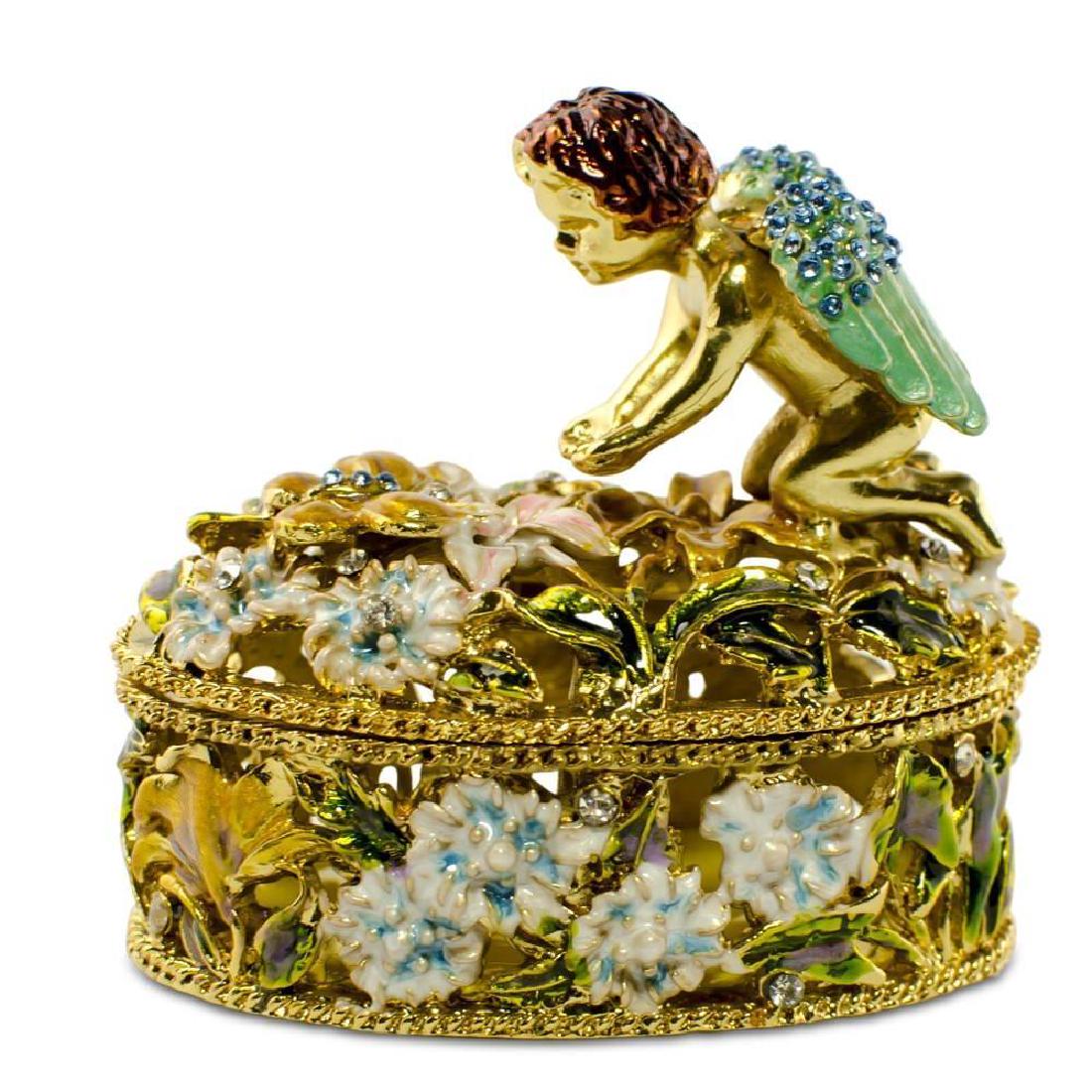 2.75" Crystal Wings Angel With Flowers Rosary Keepsake: 2.75" Crystal Wings Angel with Flowers Rosary Keepsake Box This sparkling trinket box is adorned with clear crystals and high-polished enamel with golden trim. It opens on a hinge and has a magnetic c