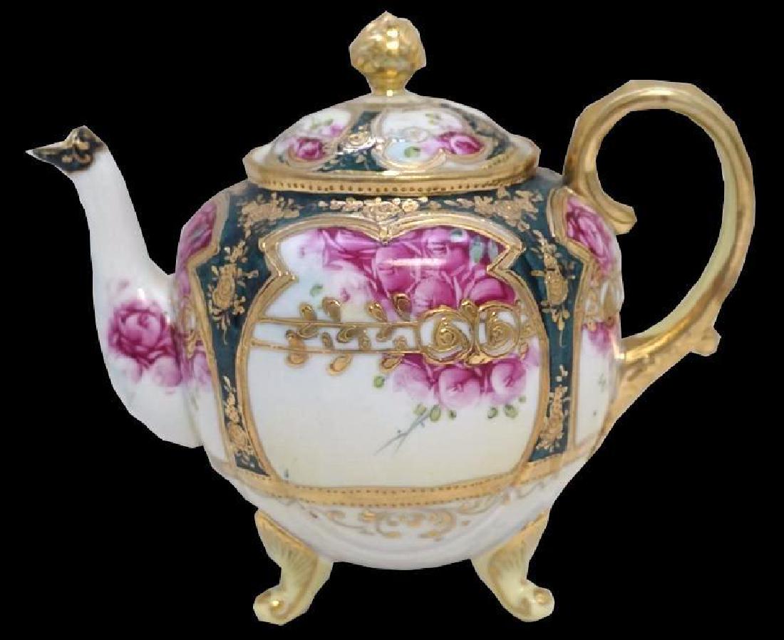 Hand Painted Nippon Porcelain Tea Pot: We are proud to present this lovely hand painted & full sized, pre 1921 7.5" x 7" tall teapot with a handsome gilded crown finial. Our example carries the prime Joan Van Patten mark #52, the Hand 