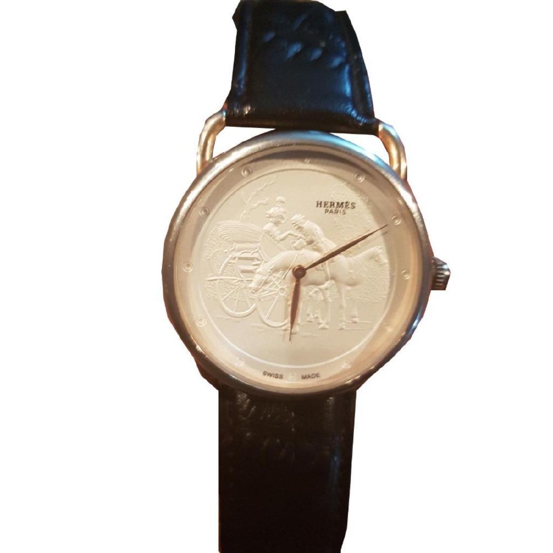 Unique Hermes Arceau Promenade de Longchamp Quartz: Designer Hermes Arceau model Promenade de Longchamp unique round white face with 12 hour dial, unisex display, analog, two-piece strap leather band, quartz ( solar powered ) movement. Arceau alum