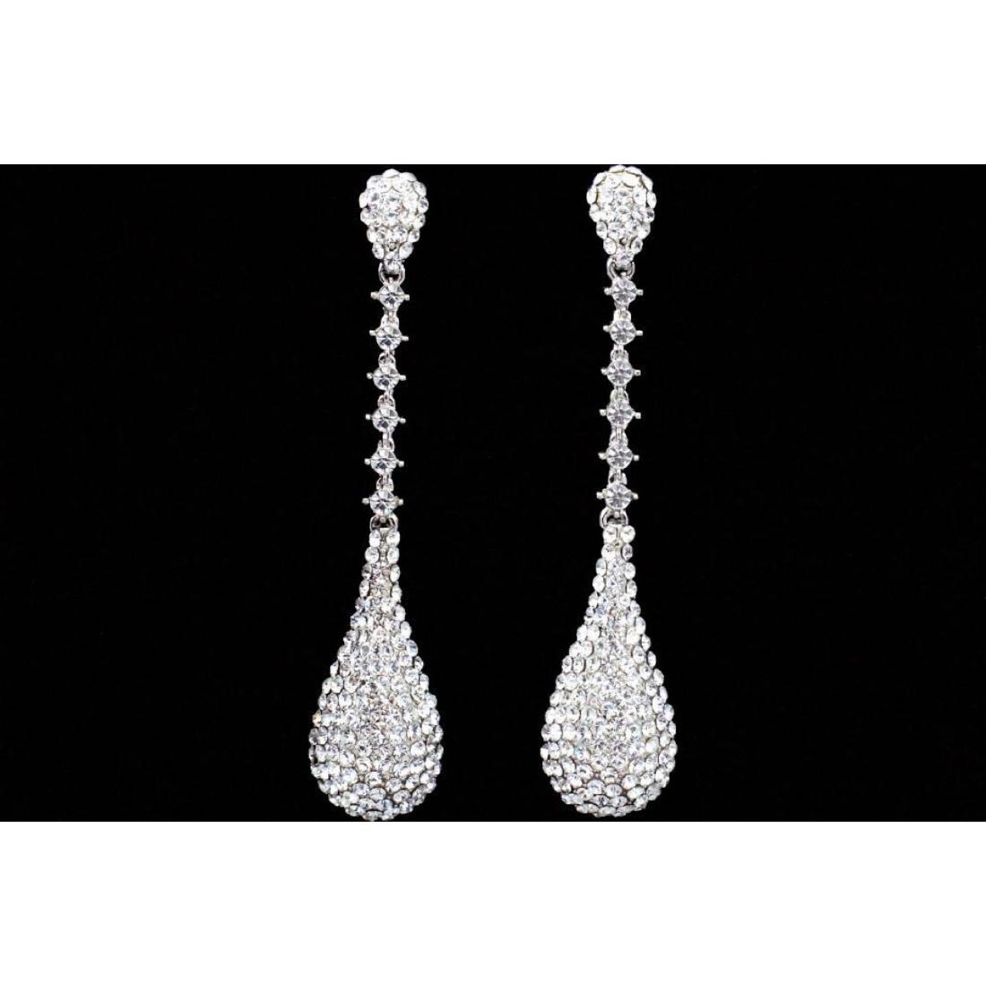 Clear Czech Crystal & Rhinestone Long Drop Chandelier: Clear Czech crystals embedded into a large dangling rhodium platedÂ teardrop style earrings. 3 1/2"L. Â 9802-031018-EB-08848