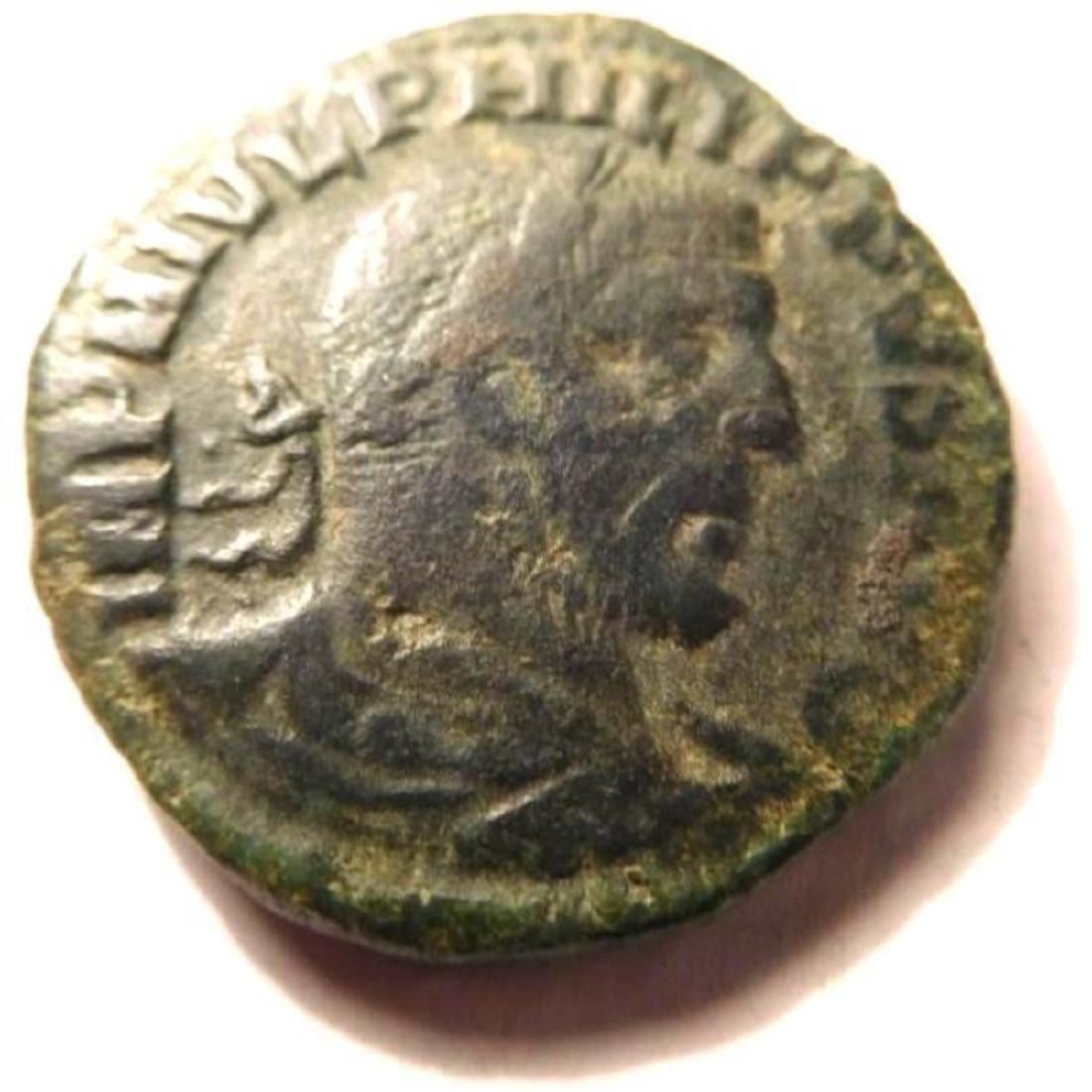 Large Sestertius of Philip I: 244-249 A.D.: The sestertius was a large, and somewhat valuable coin in Roman times, having the value of 1/4 of a denarius. The interesting reverse features the goddess Moesia between a bull and a lion. The coin me