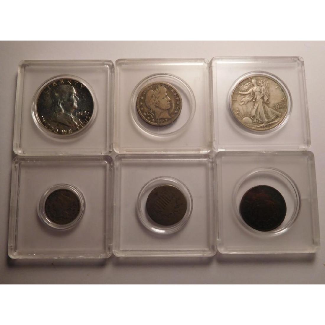 A Group of 6 American Coins (with Carrying Cases): This lot contains the following coins: - 1875 Shield Nickel - 1868 Three Cent Nickel - 1907 Barber Quarter - 1963 Franklin Half Dollar - 1943 Walking Liberty Half Dollar - 1864 Two Cent Piece Each coi