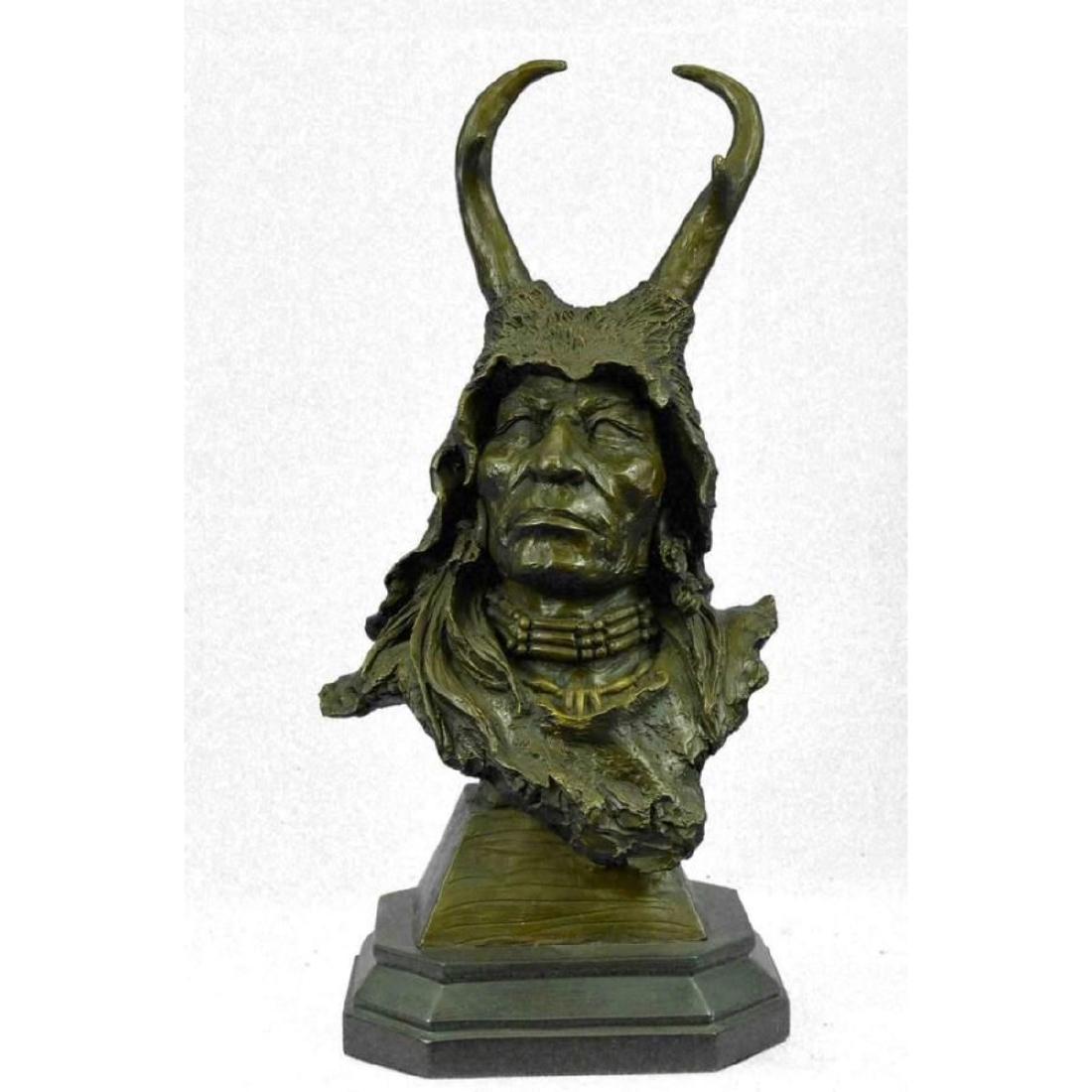 Bronze Bust Sculpture of Native American in Antler: This sculpture is 100% hot cast bronze metal and was handmade by artists using the ancient lost wax casting process. This sculpture contains no resins or cheap fillers. This sculpture is mounted on a 