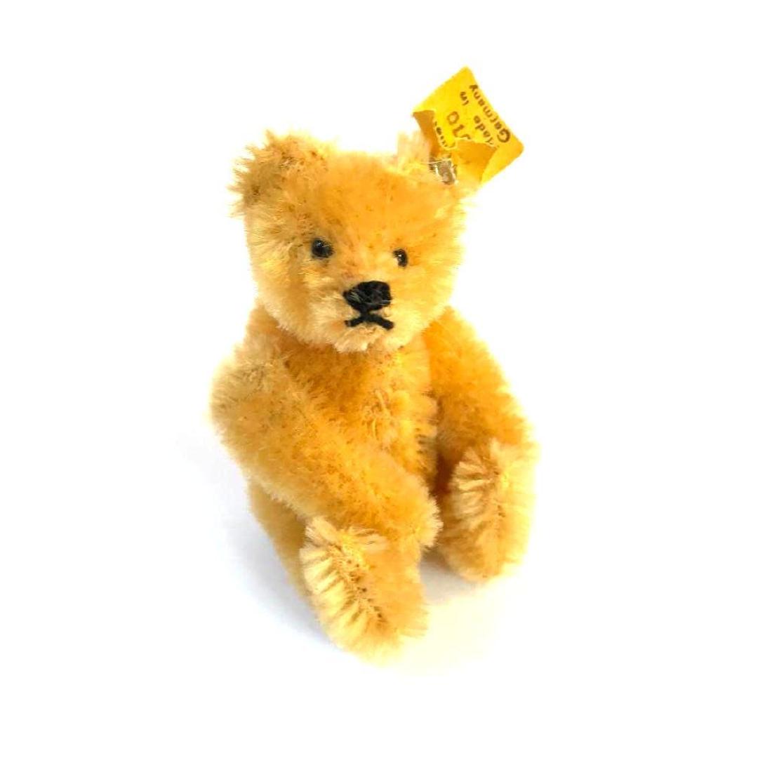 Rare Miniature German Steiff Teddy Bear: Rare miniature SteiffÂ teddy bear, jointed articulated with mohair covering. Button & tag in ear "SteiffÂ Original 5310 Made in Germany". 3 1/2" H.Â Â