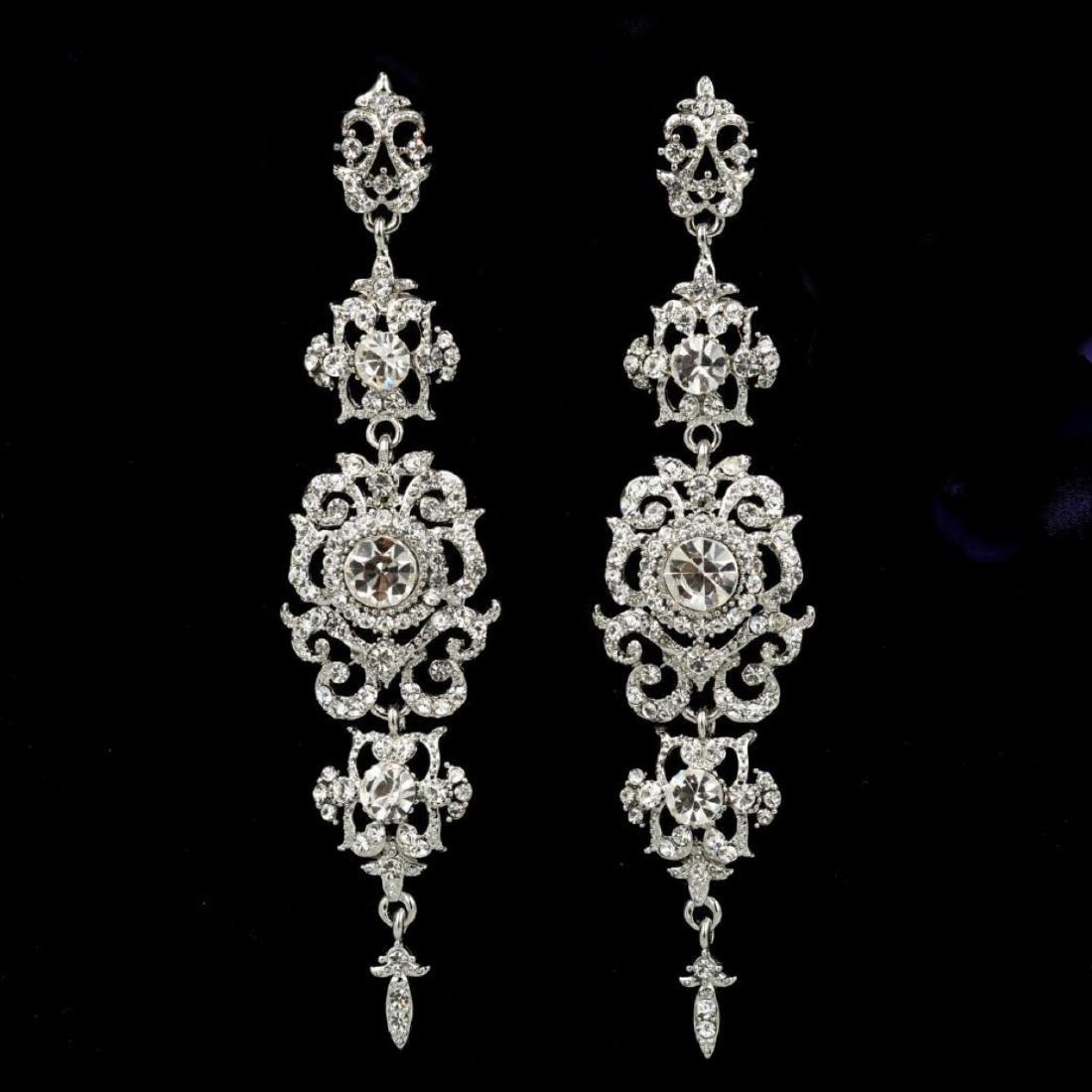 Edwardian-style Clear Czech Crystals & Rhinestones: Edwardian-style clear Czech crystals & rhinestones embedded into rhodium plated chandelier dangle drop earrings. Â 3.75" 10002-040118-EB-72884