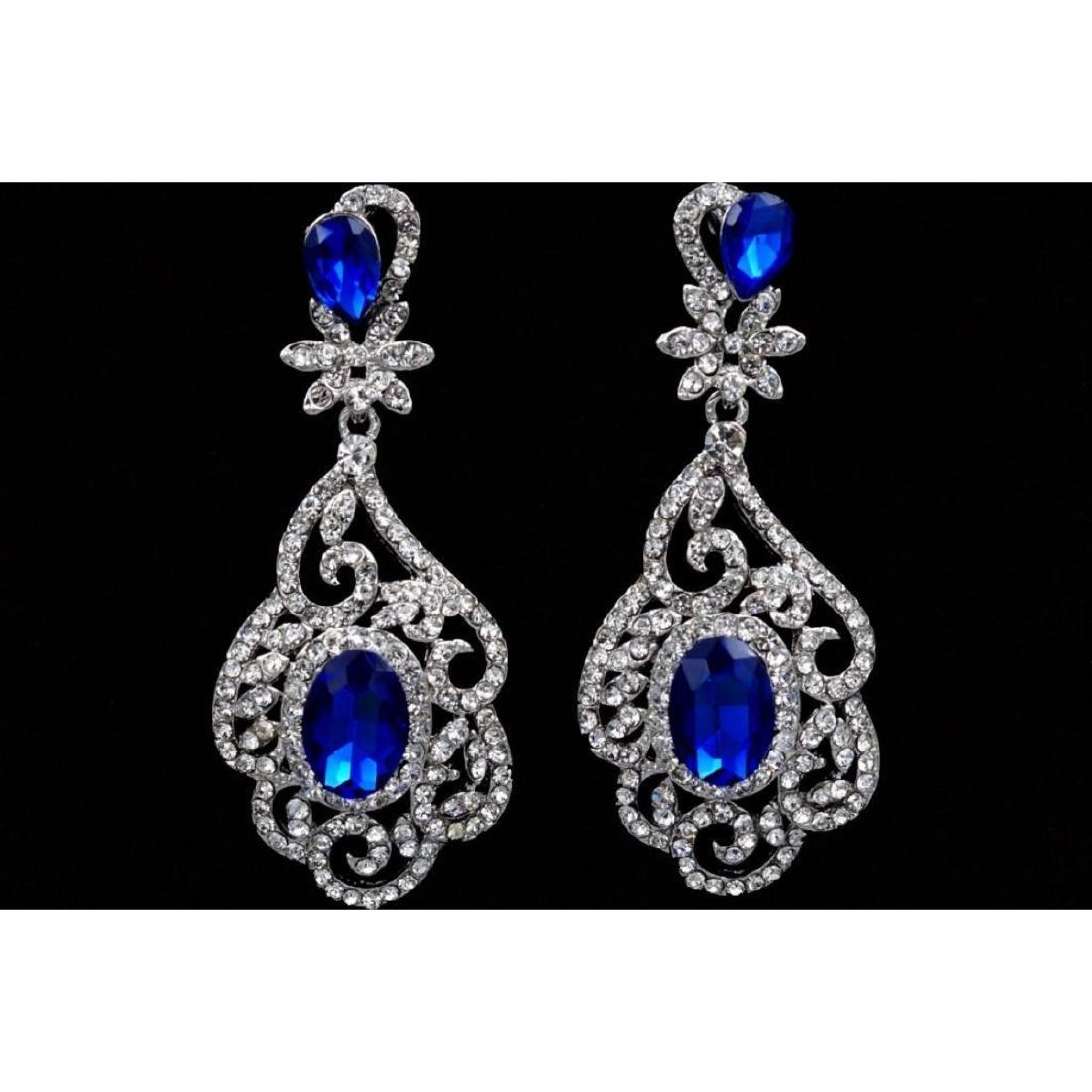 Elegant Royal Blue Czech Crystal & Rhinestone Drop: Royal blue oval & pear shaped Czech crystal focal stones, surrounded by a fretwork of clear rhinestones, embedded into 2 3/4"L drop earrings.Â Â 9803-031018-EB-81548