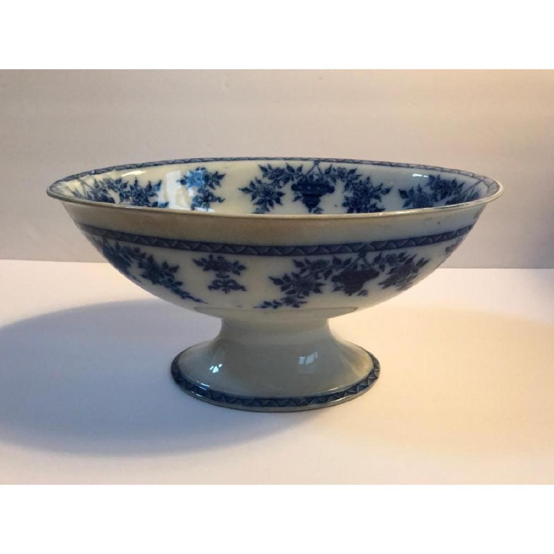 19thc Flow Blue Pedestal Fruit Compote Bowl: 19th Century large Flow Blue pedestal floral pattern fruit compote serving bowl. 12" L X 8" W X 6 1/8" H.Â
