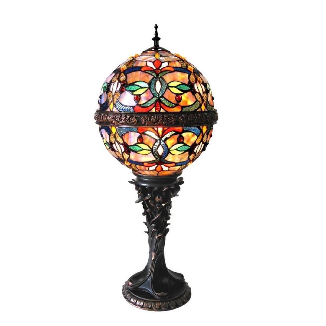 Table Lamp: This Tiffany style 1-light table lamp features a dark antique bronze finish that will complement many decors throughout your home. The intricate detail of the metal stand and ribbon around the globe s