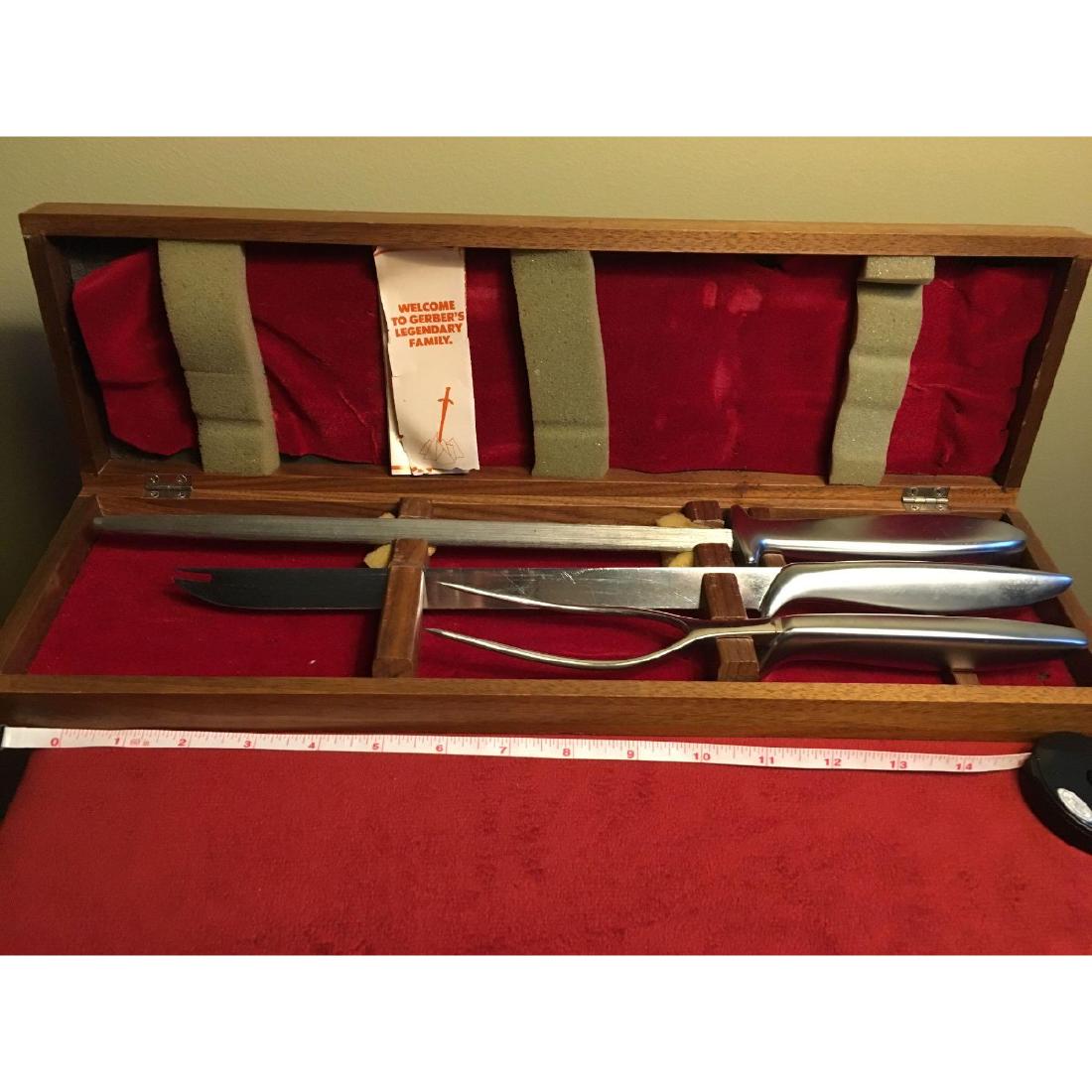 Gerber Legendary Blades In Walnut Cutlery Case: A Gerber Legendary Blades In Walnut Cutlery Case. Includes Carving Knife, Fork and Blade Sharpener. (Walnut Cutlery Case Included( - All items may be shipped or picked up locally within one week of sa