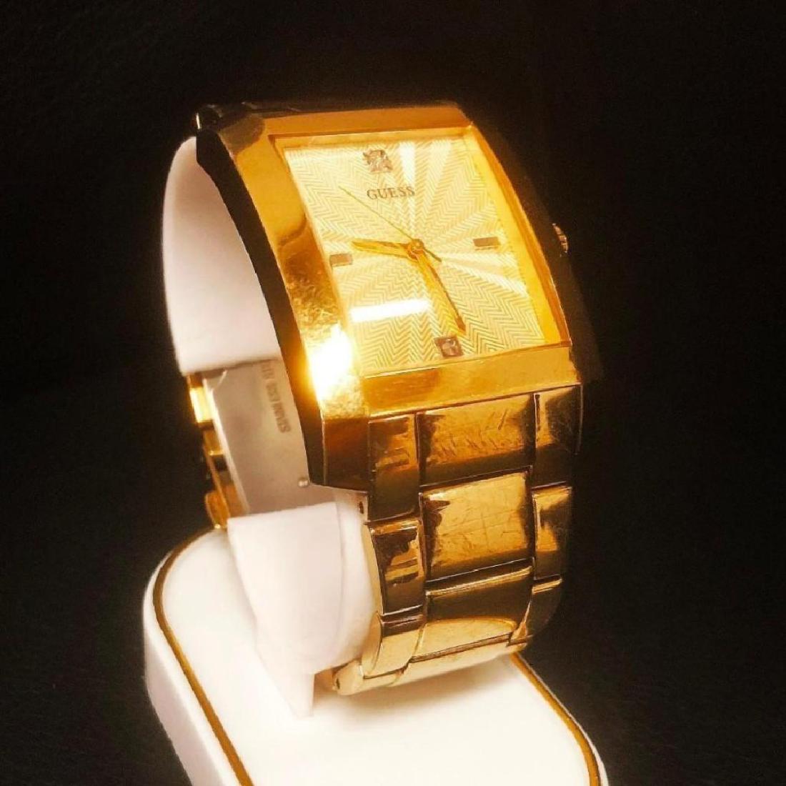 GUESS Watch, Men's: GUESS Watch, Men's Goldtone Stainless Steel Bracelet G11638G This striking yet classic watch features a goldtone stainless steel bracelet and case, dial with two diamond accent markers and 3-han