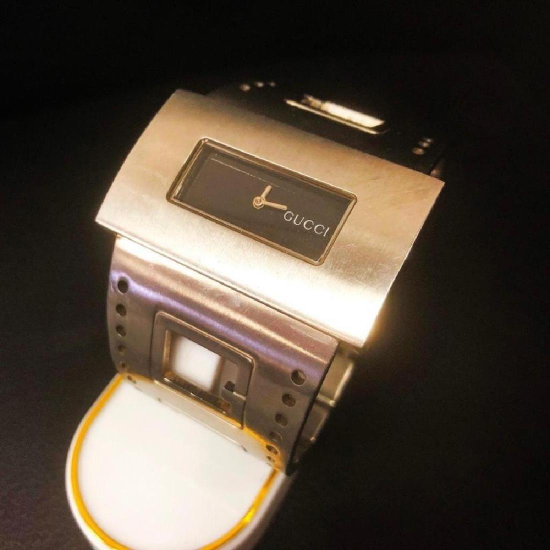 Stainless Steel Gucci Swiss Made Bangle Watch: Beautiful Modern Design. Gucci Swiss Made Watch is used, but in working condition. - All items may be shipped or picked up locally within one week of sale. We will provide shipping estimates to the wi