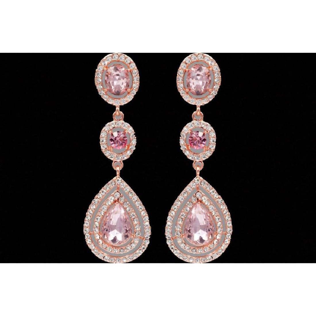 Pink Czech Crystal & Rhinestone Rose Gold Plate: PinkÂ Czech crystal teardrops surrounded by rhinestones dangle from Â round & oval shaped pink crystals surrounded by rhinestones, set intoÂ rose gold plated drop earrings. 2 3/4" L. Â 9786-03