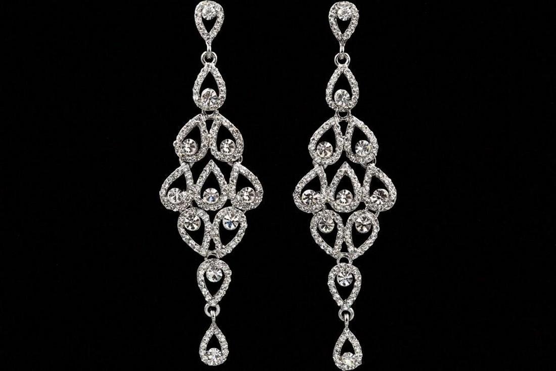 Czech Crystal Peacock Feather Chandelier DropEarrings: Chandelier style, rhodium plated, clear Czech crystals, in the form of peacock feathers, post earrings. 3 1/2" L. Â 9776-031018-EB-18652