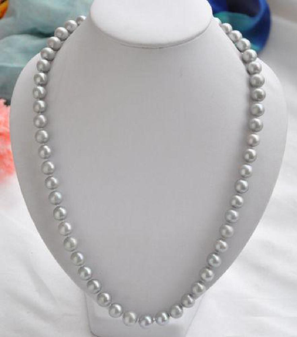 9-10mm Tahitian Gray & 14K 22" Necklace: 9-10mm Tahitian gray pearls with 14kt yellow gold clasp. 22" length.