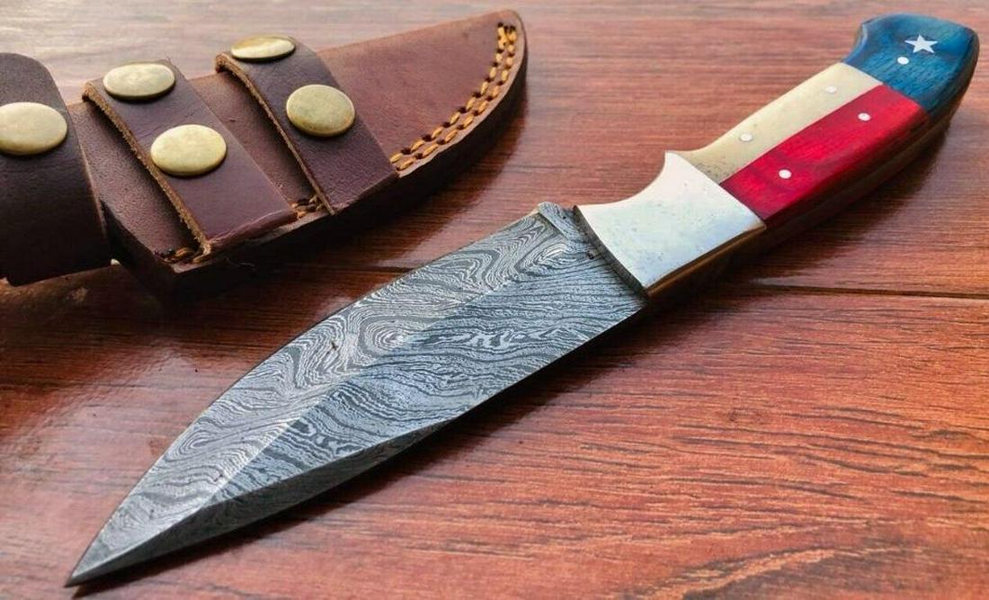 Custom Made Damascus Steel Texas Flag Hunting Knive: Custom made, Texas Flag design walnut wood handle, 4" Damascus steel blade with steel bolsters & rat tail tang & excellant file work on spine of blade. Comes with leather sheath. AJ blade brand made i