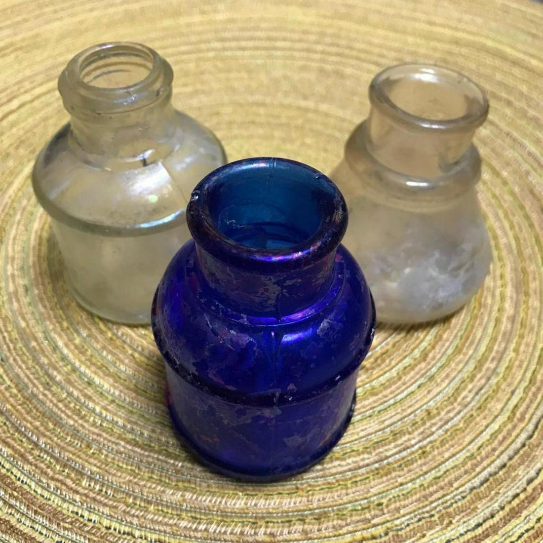 Group of 19th Century Museum Display Dug Ink Bottles: Group of three mold blown, dug ink bottles from the 19th Century, including a beautiful iridescent cobalt blue bottle, a clear bottle with raised lettering on the bottom that reads "CARTID", & a clear