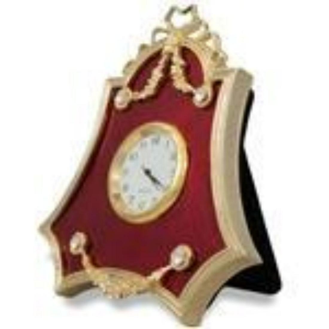 4" Faberge-Inspired Red Enameled Guilloche Russian: 4" Faberge Red Enameled Guilloche Russian Antique Style Clock The framed clock is in two color gold-mounted red enamel surrounded by a crystal set ribbon tie suspended by a laurel garland. The frame's