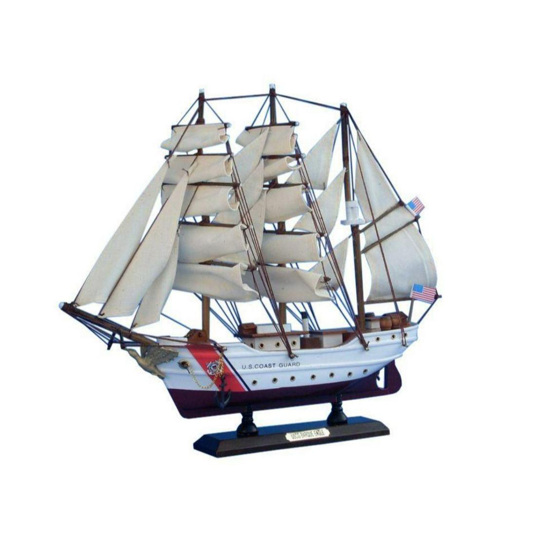 Wooden United States Coast Guard USCG Eagle Model Ship: Inspired by the USCG Eagle, one of only two active commissioned sailing ships operating in American military service, this adorable tall ship model cutter rests easily upon any shelf or desk. Add a to
