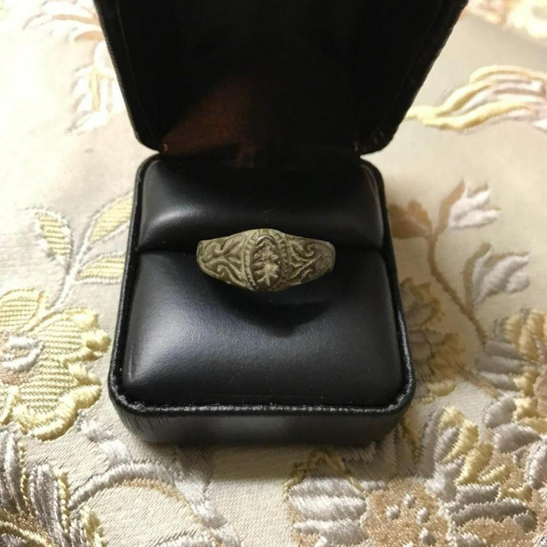 16thc English Tudor Wedding Ring, Artifact: 16th Century English Tudor wedding ring with narrow band expanding to floral decorated shoulders, oval bezel simulating a stone. Large approx size 10.