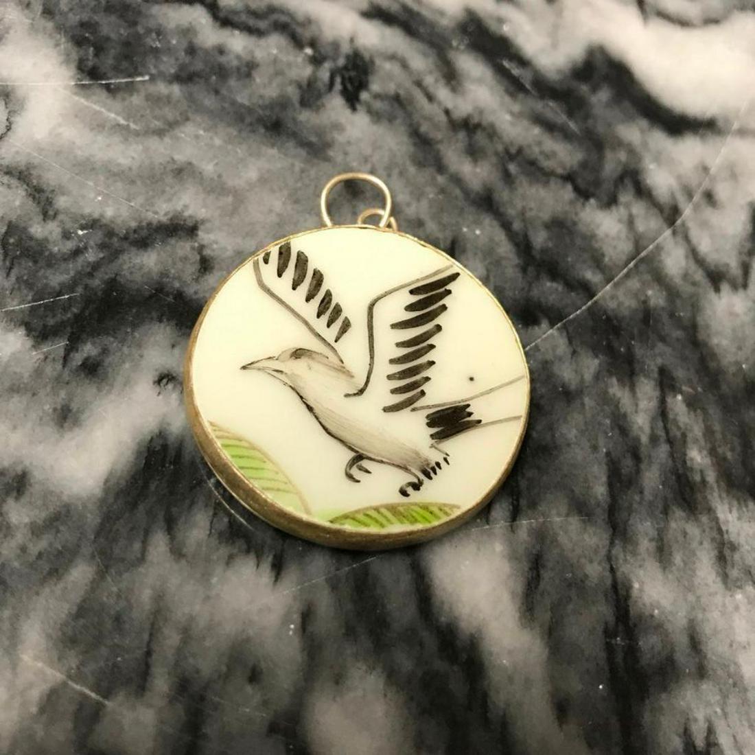 Ming Dynasty Pottery Shard Bird in Flight Pendant: Hand-painted pendant of a bird in flight, wrapped in silver plate bezel, made from a centuries old broken pottery shard, discovered at an archaeological dig at an old porcelain factory that operated f