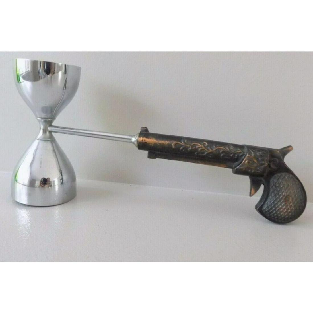 Vintage Mid Century Cocktail Bar Tool, Stylized Antique: Vintage Mid-century gentlemen's chrome & metal cocktail bar jigger tool, in the form of an antique gun, for a gun collector or arms dealer. 3 3/4" X 8". In good but used condition.