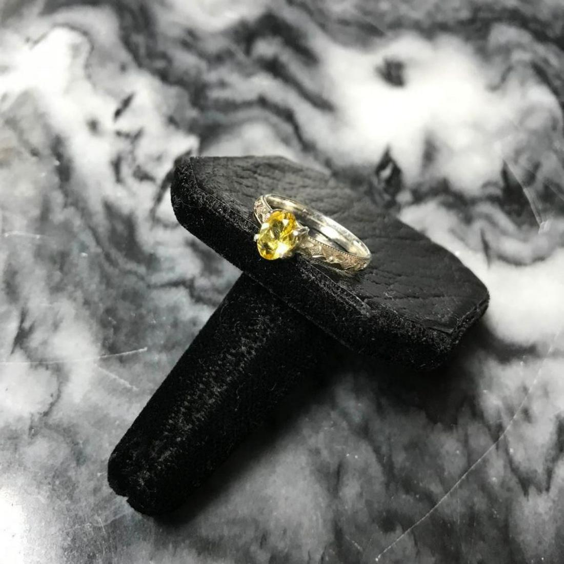Edwardian Style Yellow Sapphire Sterling Silver Ring: Edwardian-style ring with a decorative embossed sterling silver band, set with 1ct oval faceted yellow sapphire gemstone. Size 7.5.