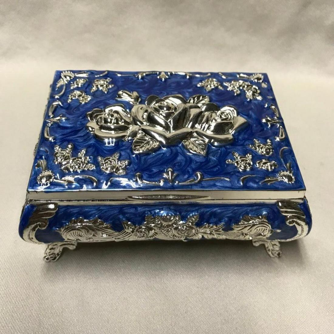 Enamel & Silver Floral Design Jewel Box: Enamel & silver gilt over pewter rose floral motif jewel box with lined interior. 3 3/4" W X 2 3/4" L X 1 3/4" H.
