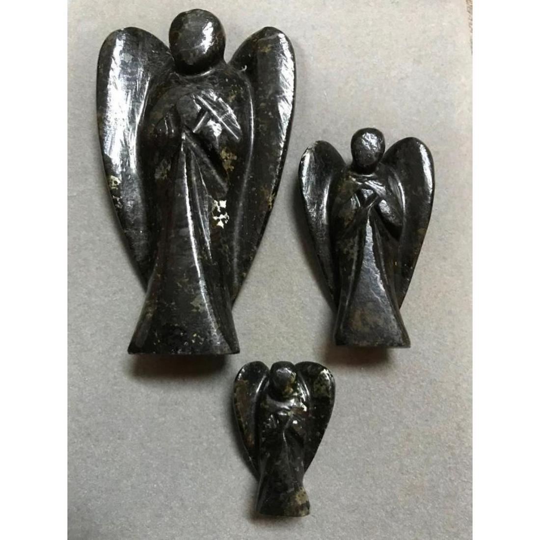 Hand-carved Set, Rare Nuummite Stone Angels, Reiki: Rare Hand-carved set of NuummiteÂ gemstoneÂ angels,Â 1", 2" & 3" standing figures. Comes in display case. The ancient stone Nuummite is of volcanic origin formed about 3.8 billion years ago, mak