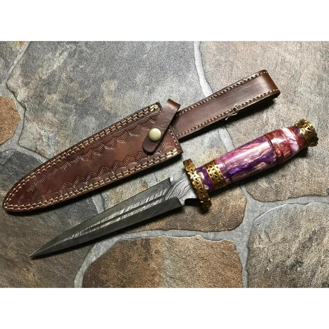 Amethyst Jewel Tone Damascus Steel Boot Dagger Knife: Amethyst jewel-tone acrylic & inlaid brass 5 1/4" L handle, 7 1/2" Damascus steel blade, boot dagger, knife. TheÂ blade of this knife has a nice file work & made of 512 layers of 4340 stainless stee