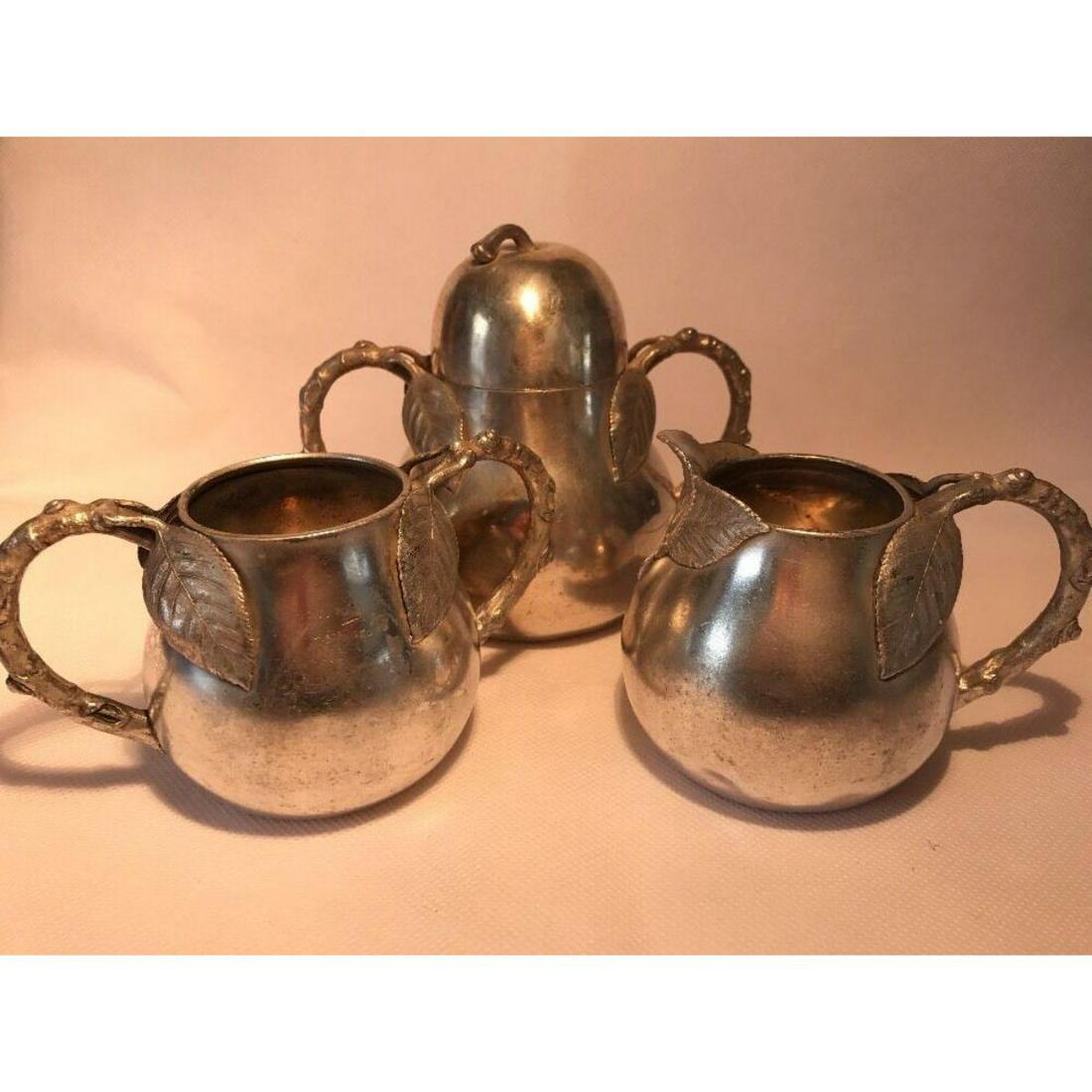 Rare 1870's Silverplate James Tufts Boston Tea: Rare Victorian 1870's Aesthetic,Â James Tufts Boston,Â silver-plate Tea Caddy, Sugar &Â Creamer.Â Numbered design 2231, shaped like a pear with twig handles and four leaves, two wrapping each