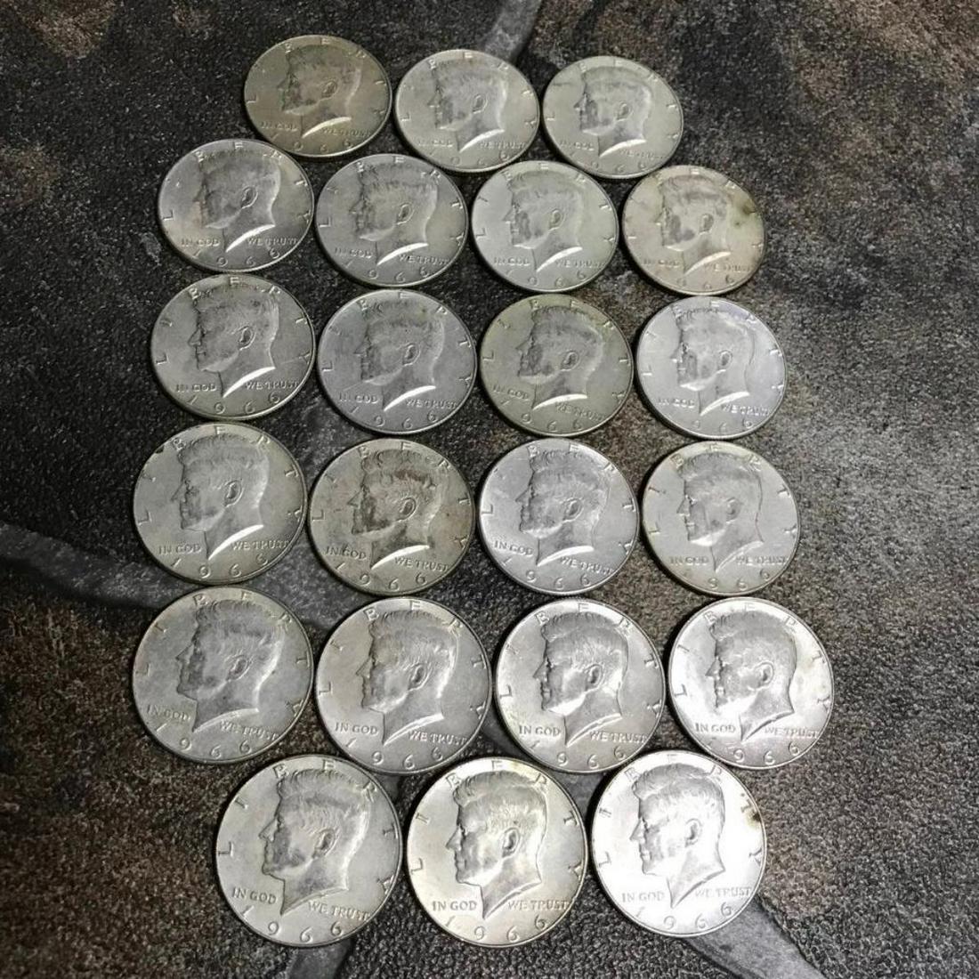 Collection of Silver Coins, 1966 Kennedy Half Dollars: Group of 22 Kennedy half dollars, all coins dating 1966, in various conditions, as pictured. From a home vault in Mississippi that was filled with 1960's era saved coins. Obverse - John F. Kennedy, 35