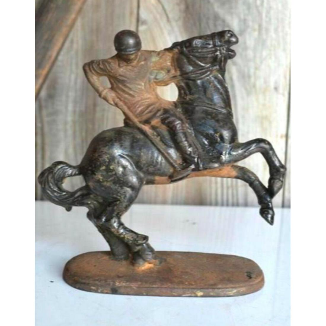 Vintage Cast Iron Polo Player Figure Horse & Jockey: Vintage cast iron bookend or doorstop statue of a polo player riding his horse. Approx.Â 6" H X 6" L.Â