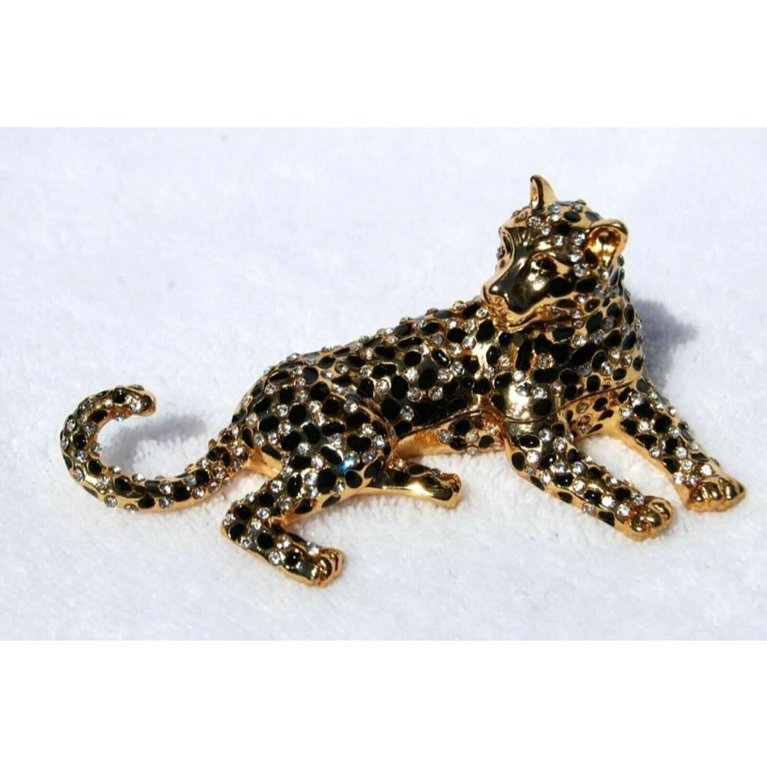 Swarovski Crystal Enameled Leopard Jewel Trinket Box: Swarovski crystal jeweled enamel & gilt trinket, jewel box, in the form of a leopard. The box opens from the middle on a hinge to reveal an enameled interior for storing tiny trinkets or jewels. 3 1/2