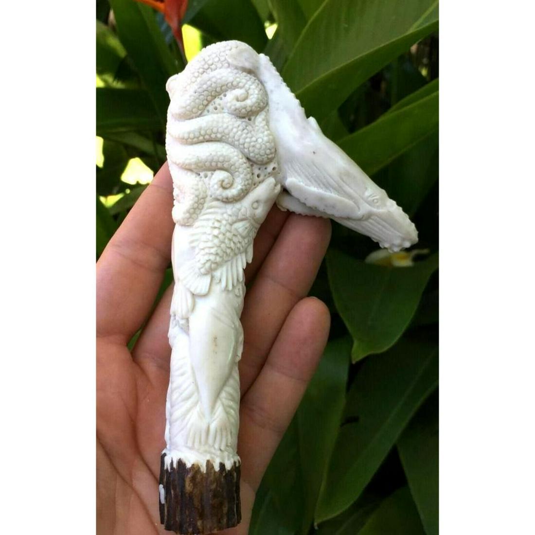 Handcarved Antler Cane Handle, Octopus, Whale, Ocean: Hand-carved shed deer antler, in the form of ocean seaÂ life - whale, octopusÂ fish, seal, walrus. One of a kind artwork, cane handle, dagger knife handle, sculpture.