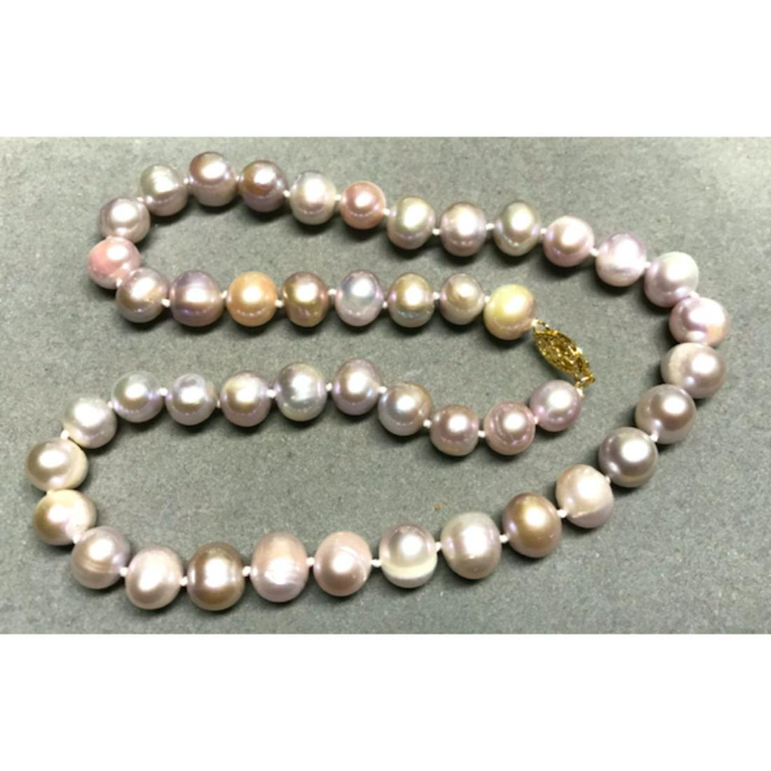 9-10mm Pink & Purple South Sea Baroque Pearls 18": 9-10mm Pink & Purple mixed colorÂ South Sea Baroque Pearls 18" necklace with 14kt yellow gold clasp. ** several ringed pearls with mixed shades & some with a chalky luster.