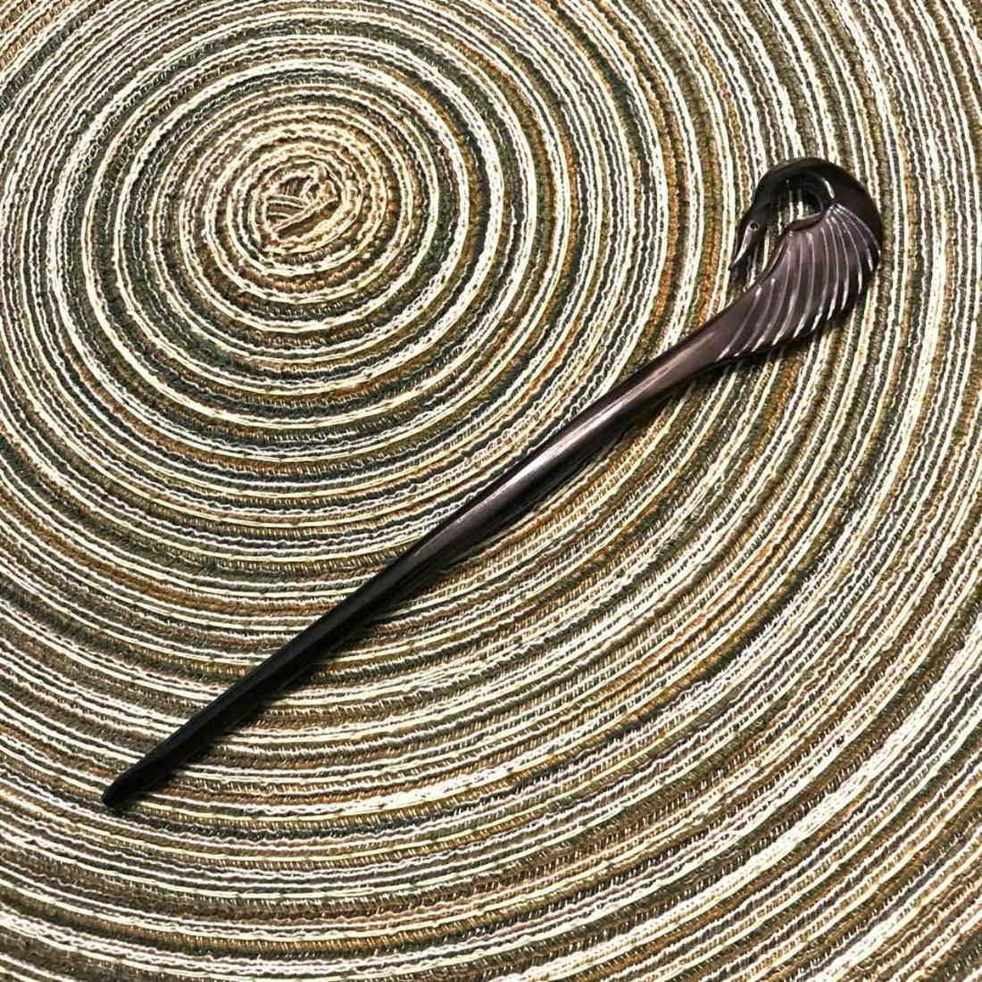 Carved Horn Hair Stick, Black Crane Heron Swan Bird: Hand-carved organic dark buffalo horn, hairÂ stick decoration embellishment, in the form of a crane, swan, or heron bird. 6 3/4" L X 1"W.