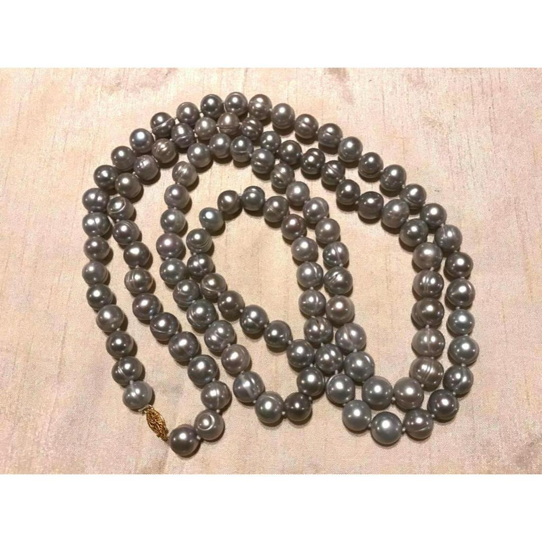 12-13mm Large Baroque Gray Pearls 50" Necklace: 12-13mm large Baroque gray pearls 50" necklace with 14kt yellow gold clasp. * pearls are heavily ringed, with someÂ irregular in shape, per photos.
