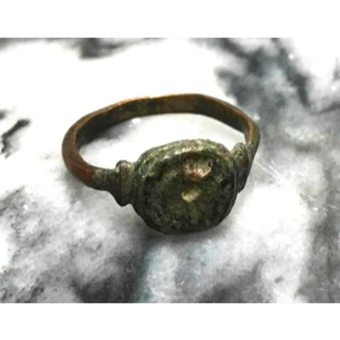 Byzantine Pilgrim's Copper Rich Man's Bronze Artifact: Byzantine pilgrim men's ring, copper-rich bronze artifact. Round stepped bezel with a rounded band, ornately flared at bezel. Wearable size 12.