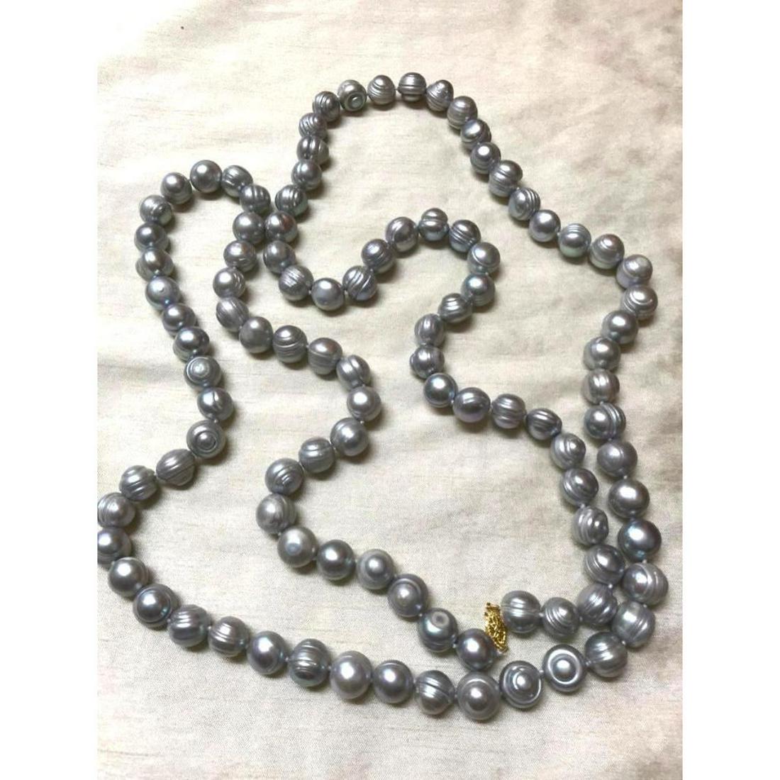 12-13mm Large Baroque South Sea Gray Pearl 50" Necklace: 12-13mm Large Baroque South Sea gray pearl 50" necklace with 14kt gold clasp. * all are natural ringed pearls, per photos.