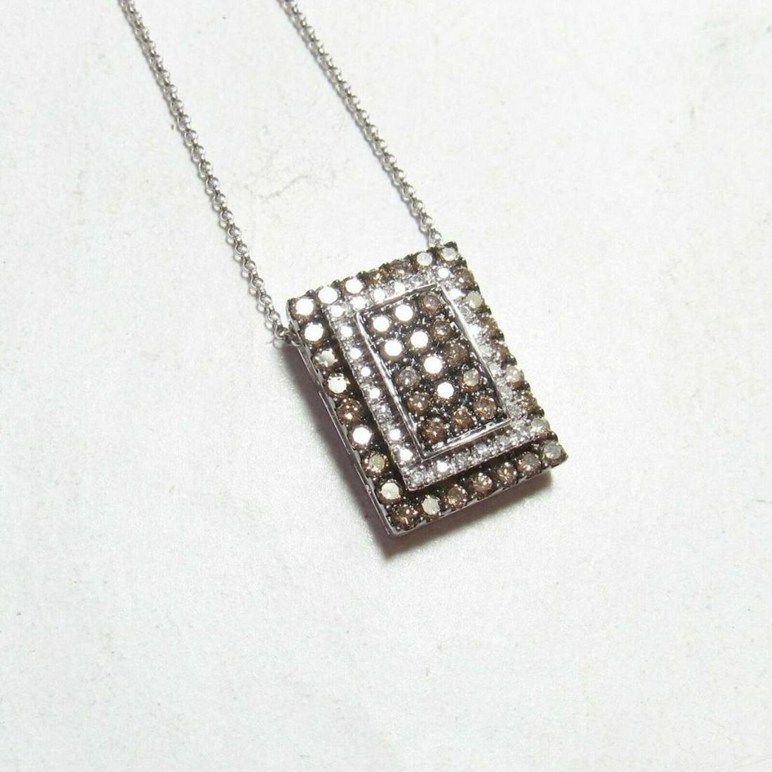 Estate 1.25cts White & Cognac Diamonds 14kt White Gold: Estate white & cognac diamonds 14kt white gold pendant, marked 14K, & consisting of 26 white ( I color ) single & 43 cognac brilliant diamonds. The 69 are SI2 clarity ( with some I1s ) with an approx