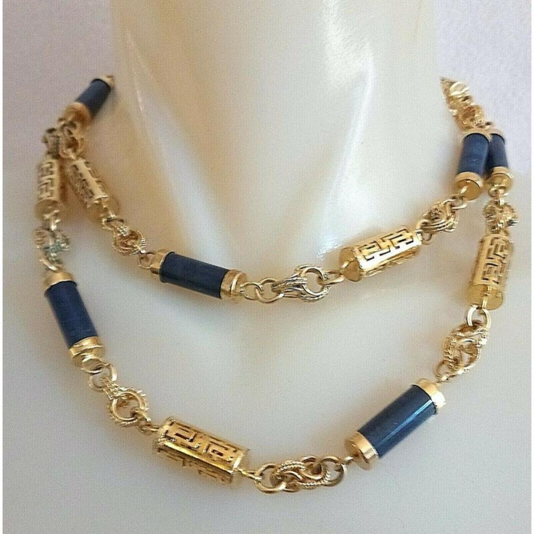 Vintage Designer GIVENCHY Lapis Logo Necklace: Vintage designer necklace, GIVENCHY, gold plated pierced logo cylinder beads, along with faux lapis & gold plated cylinder beads, 30" necklace.